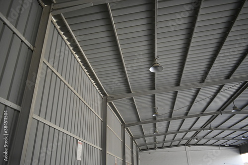 Industrial warehouse construction and interior and outdoor view of the roof ceiling structure. 