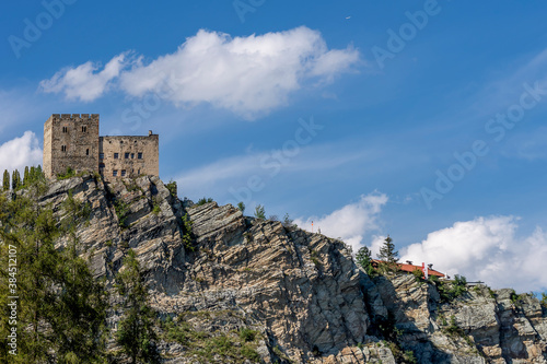 View of Laudegg Castle, overlooking a slate ledge, Ladis, Serfaus, Austria, against a beautiful sky