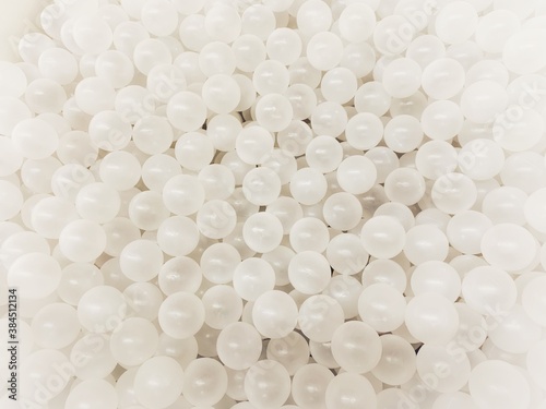 Top view of many white balls in ball pool.