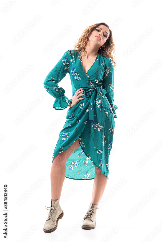 Proud young fashionable woman in dress posing with head back attitude. Full body portrait isolated on white background