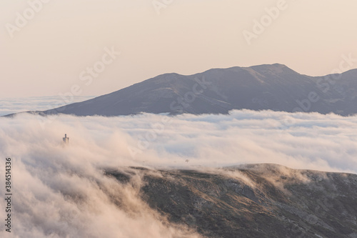 Amazing and cloudy sunrise in the mountains. Cloudscape in Spain.