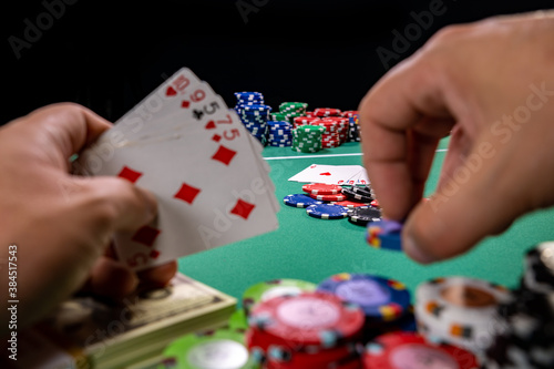 Playing poker holding cards