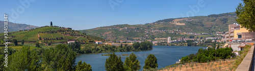 Panoramic aerial view at the Douro river on Regua, typical landscape of the highlands in the north of Portugal, levels for agriculture of vineyards