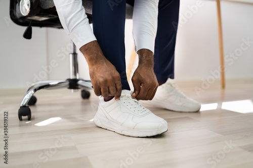 African American Man Changing To Sports Shoes