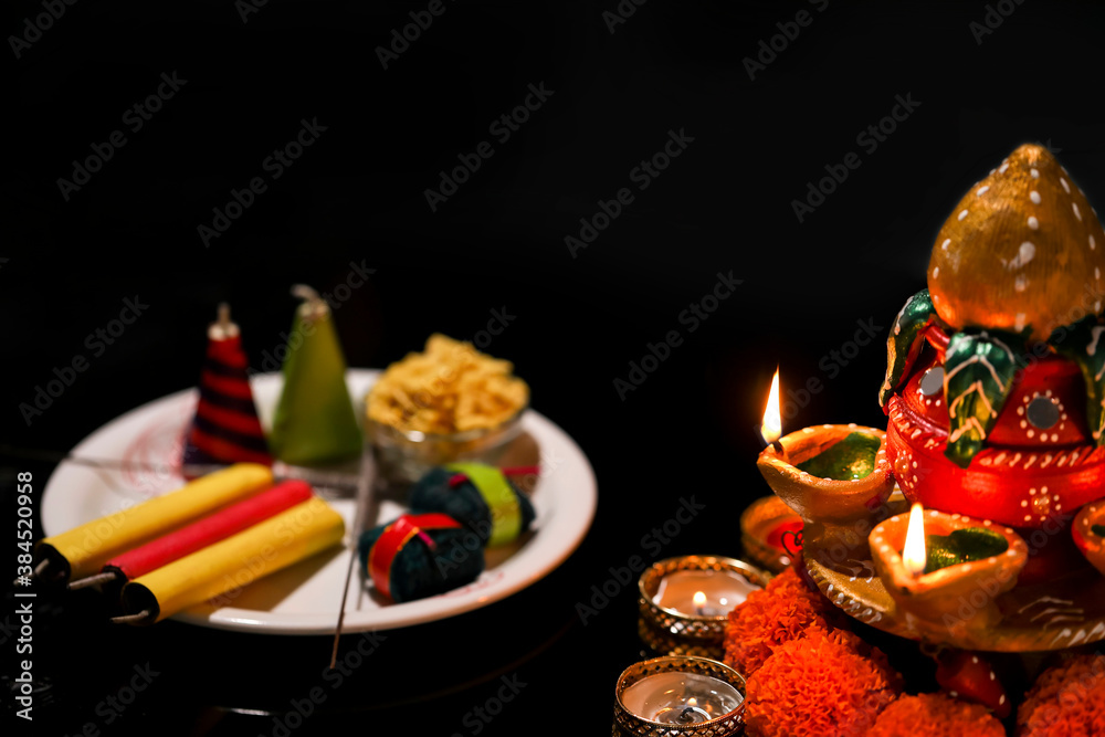 fire crackers,lamp and flower on dark background , Indian festival Diwali