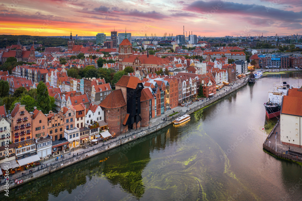 Aerial view of the Gdansk city over Motlawa river with amazing architecture at sunset,  Poland