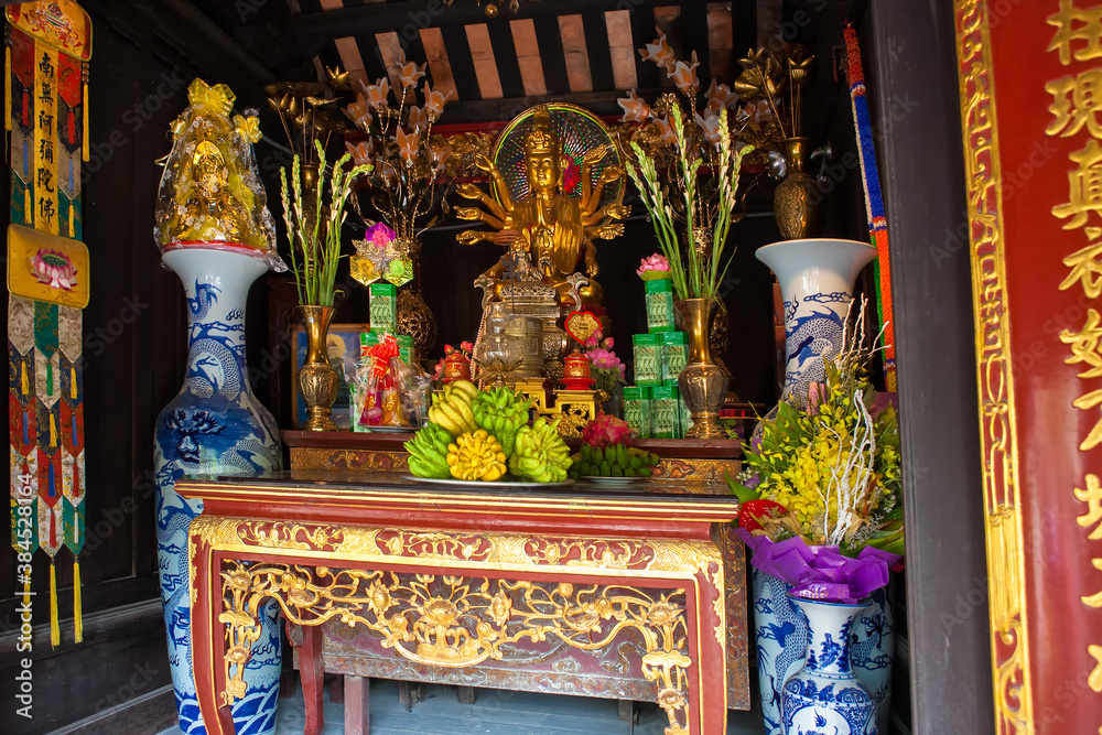 The altar and offerings in the One Pillar Pagoda (Chua Mot Cot), Ba Dình, Hanoi, Vietnam: one of Vietnam's most iconic and revered temples