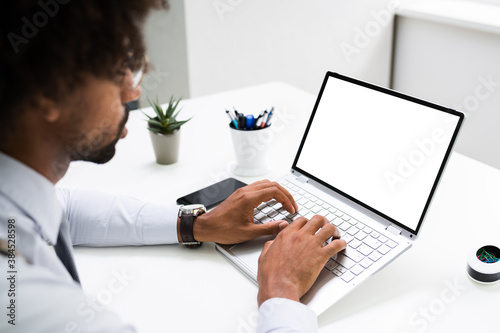 African American Hand Working On Laptop Computer