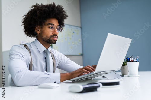 African American Business Man Using Laptop Computer