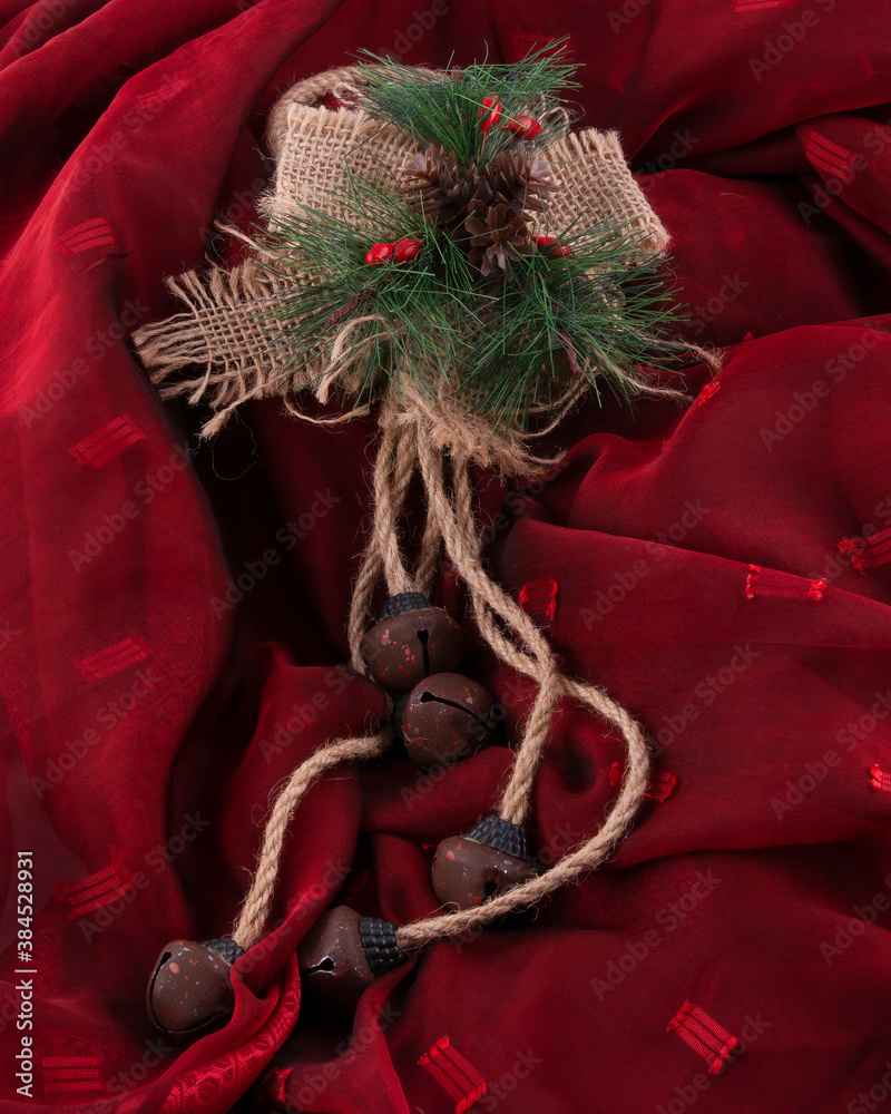 Rustic Christmas decoration on red fabric. Concept of traditional celebration background