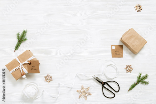 Homemade gift box with tags for family, Christmas present box wrapped in kraft paper