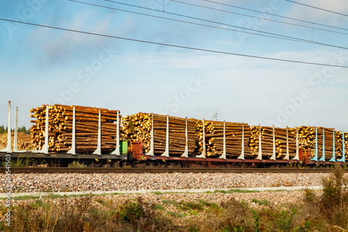 Kouvola, Finland - 24 September 2020: Railway carriages with timber at paper mill Stora Enso photo