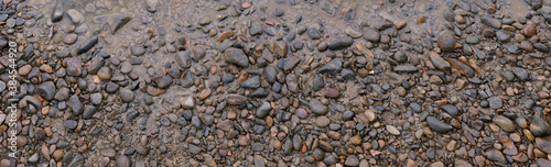 texture of wet stones river bank