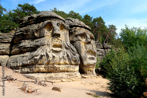 Devil's Head (Certovy Hlavy), two faces carved in sandstone rocks, Kokorin Forest, Village Zelizy, Czech Republic