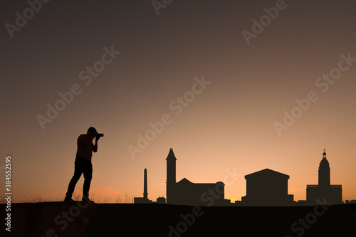 man in front of birmingham city skyline