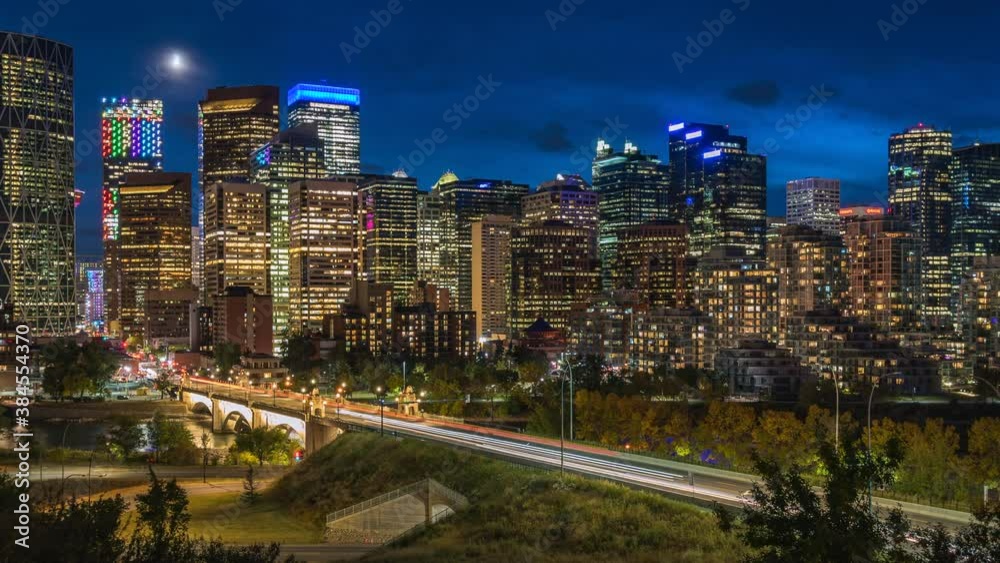 Calgary, Alberta, Canada, zoom in time lapse view of Calgary skyline showing high rise buildings in the financial district at dusk. Calgary, Alberta, Canada, zoom in time lapse view of Calgary skyline showing high rise buildings in the financial district at dusk.