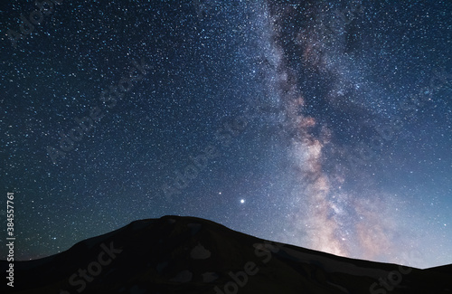 Beautiful bright milky way galaxy over the hill.