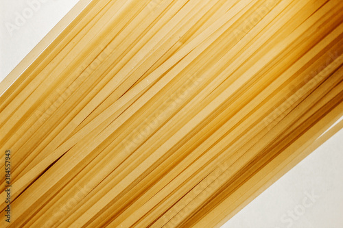 Macro shot pasta noodles texture. Macaroni background pattern. Top view. Dry pasta for cooking. Abstract italian macaroni background