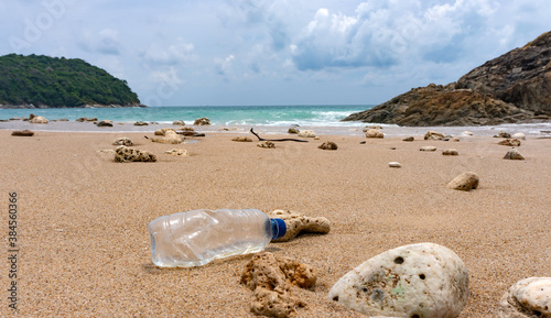 Plastic bottle waste is an environmental pollution on the beach © pkproject