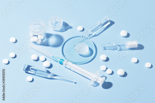 Pharmaceutical drugs on the blue background, concept of complex treatment