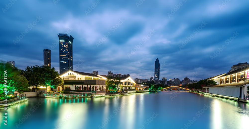 Fototapeta premium The night view of ancient buildings and modern urban buildings in Nantang Street, Wenzhou