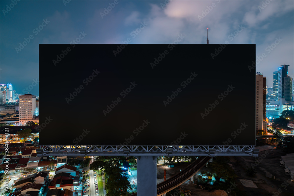Blank black road billboard with Kuala Lumpur cityscape background at night time. Street advertising poster, mock up, 3D rendering. Front view. Concept of marketing to promote or sell idea or product. Blank black road billboard with Kuala Lumpur cityscape background at night time. Street advertising poster, mock up, 3D rendering. Front view. Concept of marketing to promote or sell idea or product.