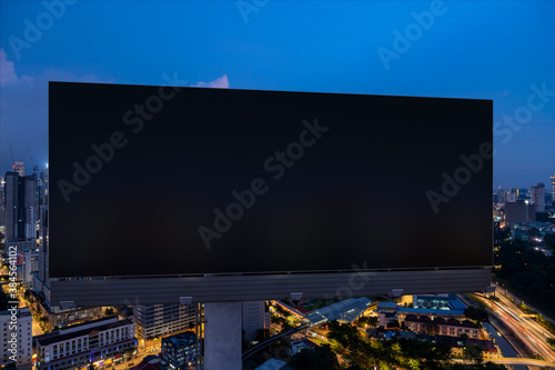 Photography Blank black road billboard with Kuala Lumpur cityscape background at night time