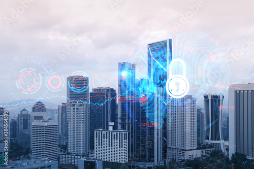 Padlock icon hologram over panorama city view of Kuala Lumpur to protect business  Malaysia  Asia. The concept of information security shields. Double exposure.