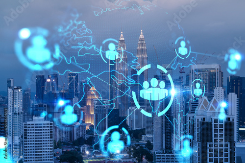 Canvas Print Glowing Social media icons on night panoramic city view of Kuala Lumpur, Malaysia, Asia