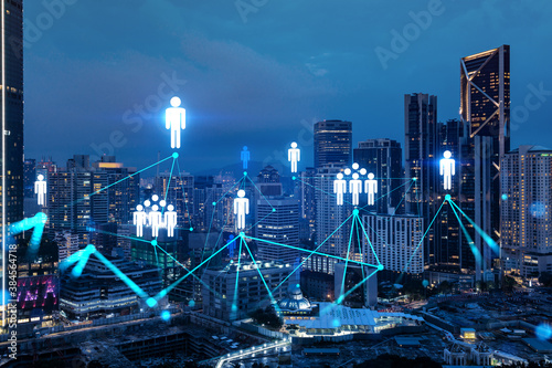 Canvas Print Glowing Social media icons on night panoramic city view of Kuala Lumpur, Malaysia, Asia