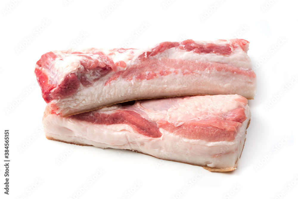 Two pieces of raw bacon meat on a white background. Butcher shop. The concept of fresh, natural products.