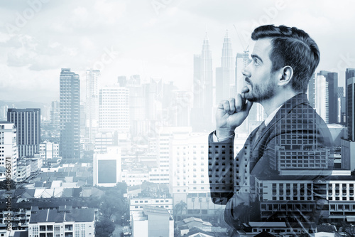 Photography Young handsome businessman in suit with hand on chin thinking how to succeed, new career opportunities, MBA