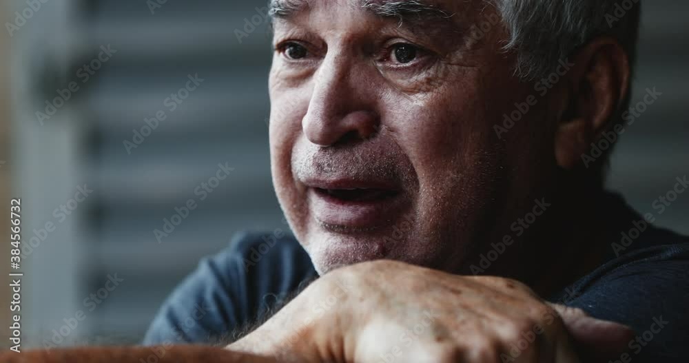 Desperate old man crying. Senior wiping tears in crisis