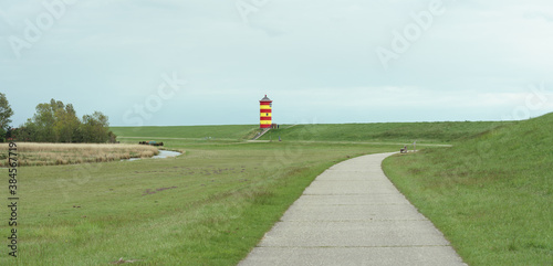 Foto Leuchtturm von Pilsum an der deutschen Nordseeküste