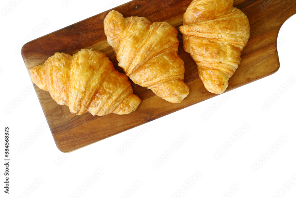 homemade croissants on wooden cutting board isolated on white background homemade croissants on wooden cutting board isolated on white background