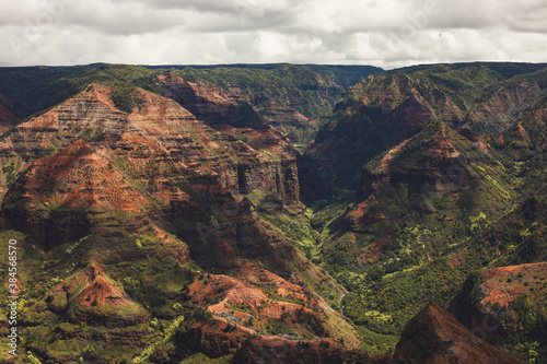 Waimea Canyon, also known as the Grand Canyon of the Pacific, is a large canyon, approximately ten miles long on the western side of Kauaʻi in the Hawaiian Islands in USA