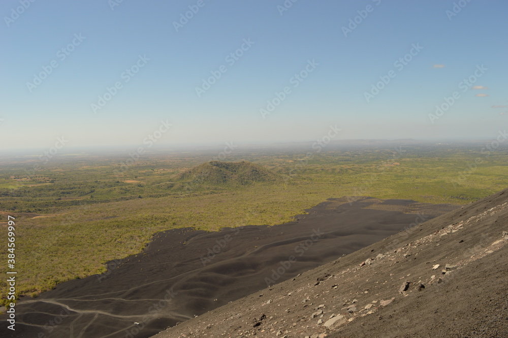 Fototapeta premium Hiking and snowboarding in the volcanic ashes on the Nicaraguan Volcanoes outside of Léon, Central America