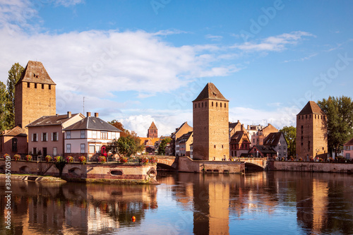 Obraz na płótnie Ponts Couverts in Strasbourg. View on the towers reflecting in water, picturesque landscape of Strasbourg city by the canal, Alsace, France. w salonie