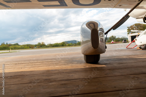 landing gear plane on the wooden ground in the aircraft hangar photo