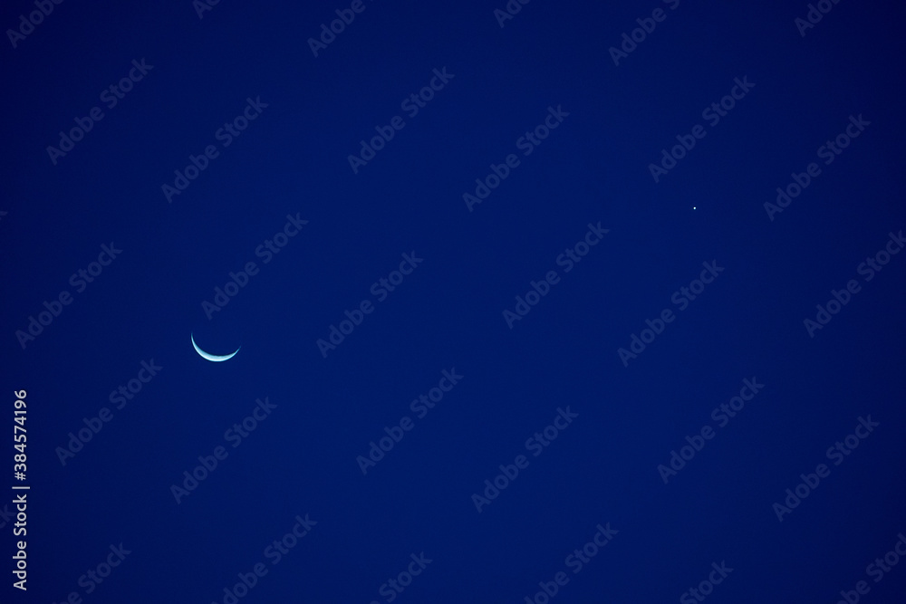 Crescent moon in sky.