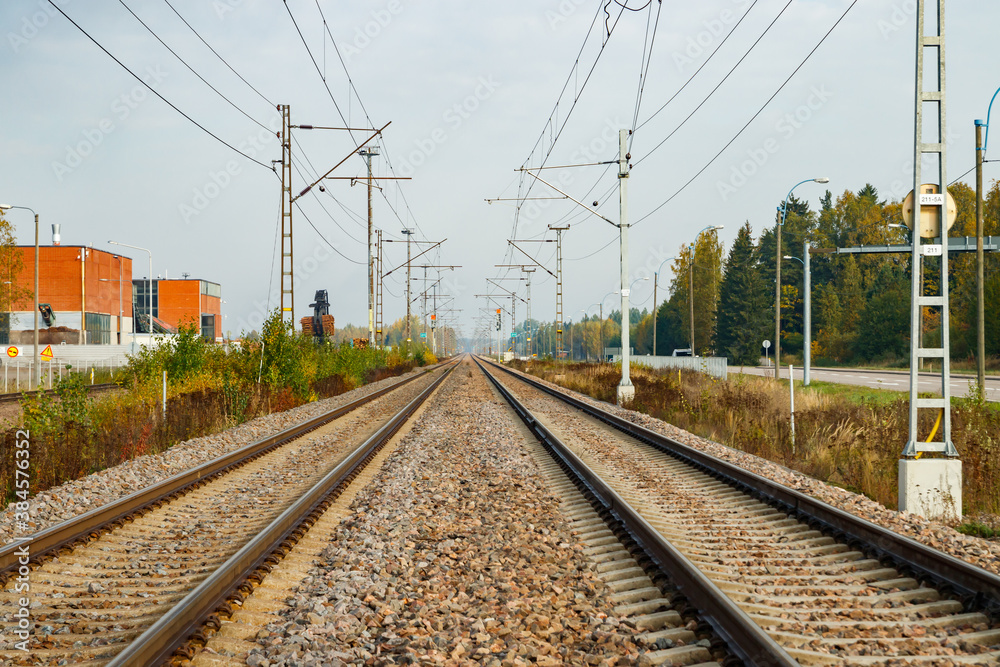 Two lane railroad with electric power lines