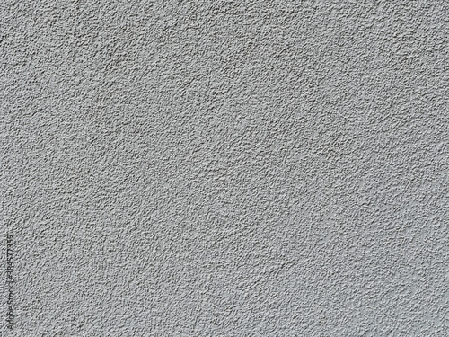 part of a relief concrete wall with spots - surface texture