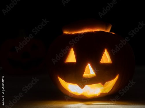 Pumpkin lantern with a burning candle inside