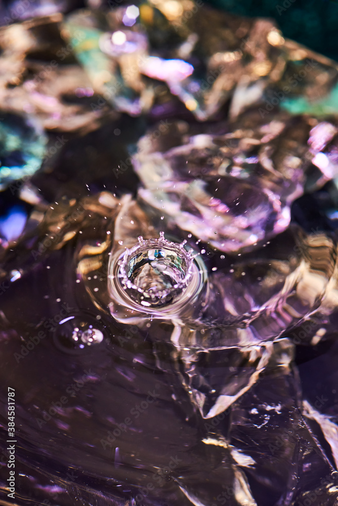 Splash of water from falling Kali, circles on the water, abstract pattern, frozen water splashes.