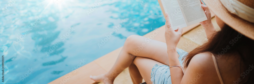 Happy woman enjoying on the pool in summer vacation, holiday concept.