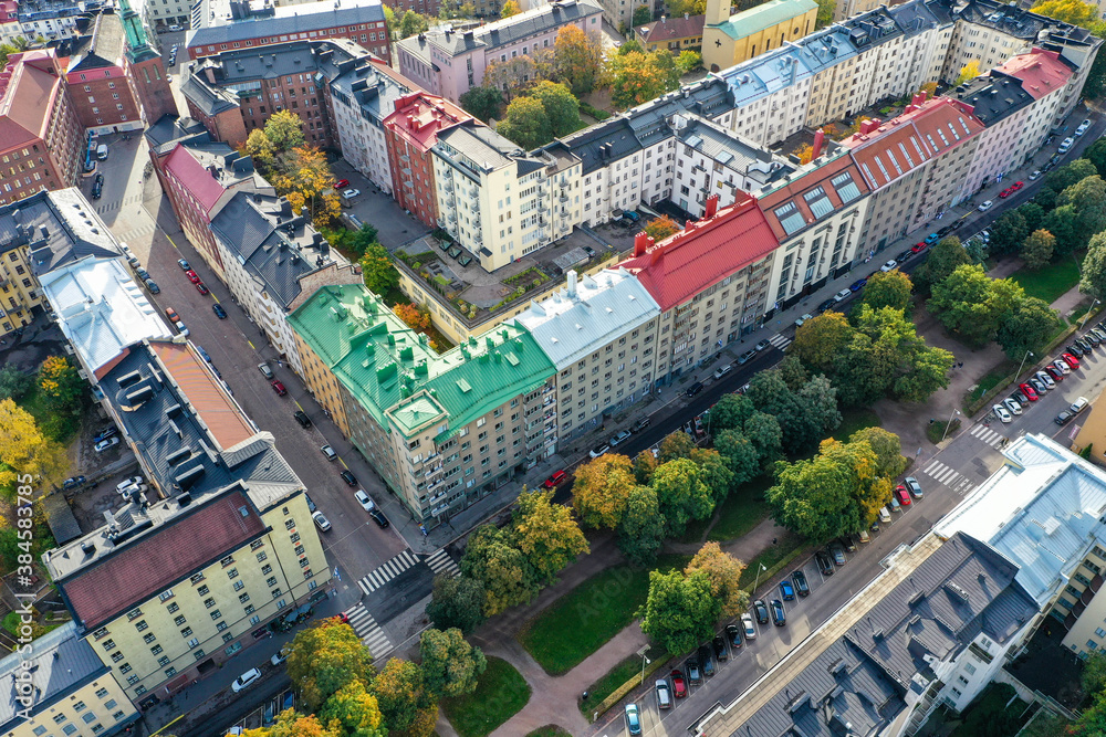 Aerial view of beautiful colorful old buildings in Helsinki, Finland. Fall color trees and sunshine.