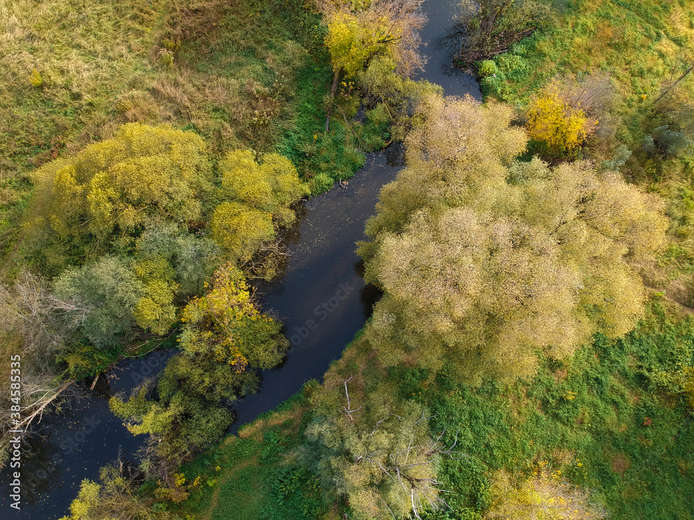 Aerial drone view of autumn forest and small river Aerial drone view of autumn forest and small river