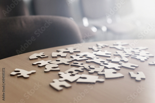 The puzzle lies on the office table. Business problem solution. Business team concept.