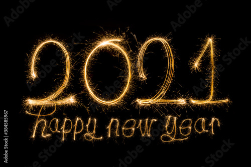 Happy New Year 2021. Sparkling burning text Happy New Year 2021 isolated on black background.