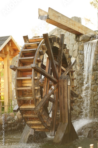 Water Wheel or Watermill Turbine Grinding, Turning, and Generating Power photo